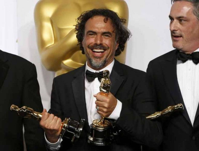 "Birdman" Director Inarritu and producer Lesher pose with the Oscars for Best Director, Best Original Screenplay and Best Picture backstage at the 87th Academy Awards in Hollywood