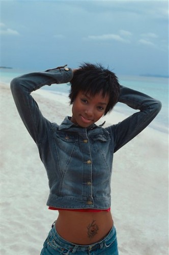 646-02072727 Model Release: Yes Property Release: No Portrait of young African-American woman at the beach