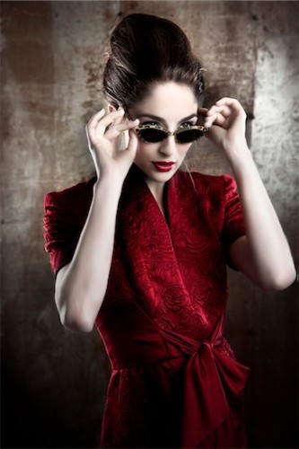 700-06145090 © Siephoto Model Release: Yes Property Release: No Portrait of Woman Wearing Red Dress and Sunglasses